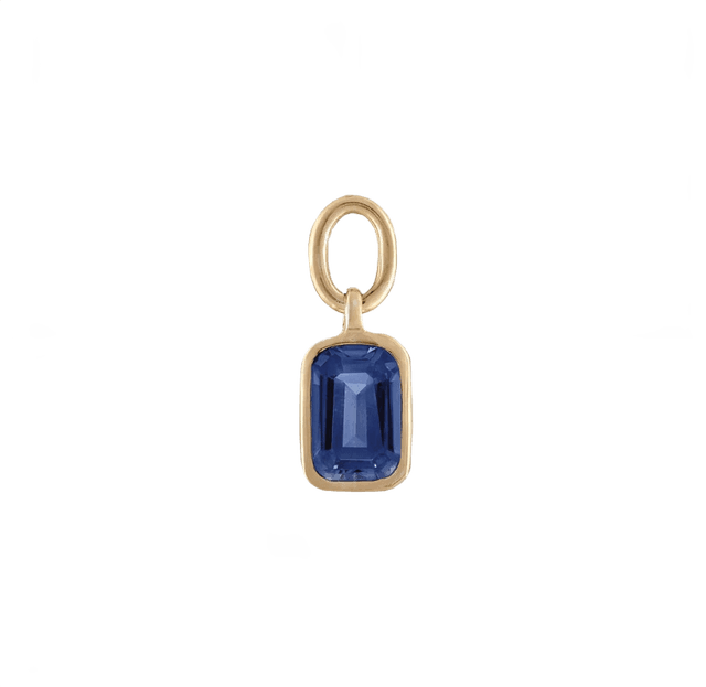 Blue gemstone charm bracelet featuring a collegiate emblem.